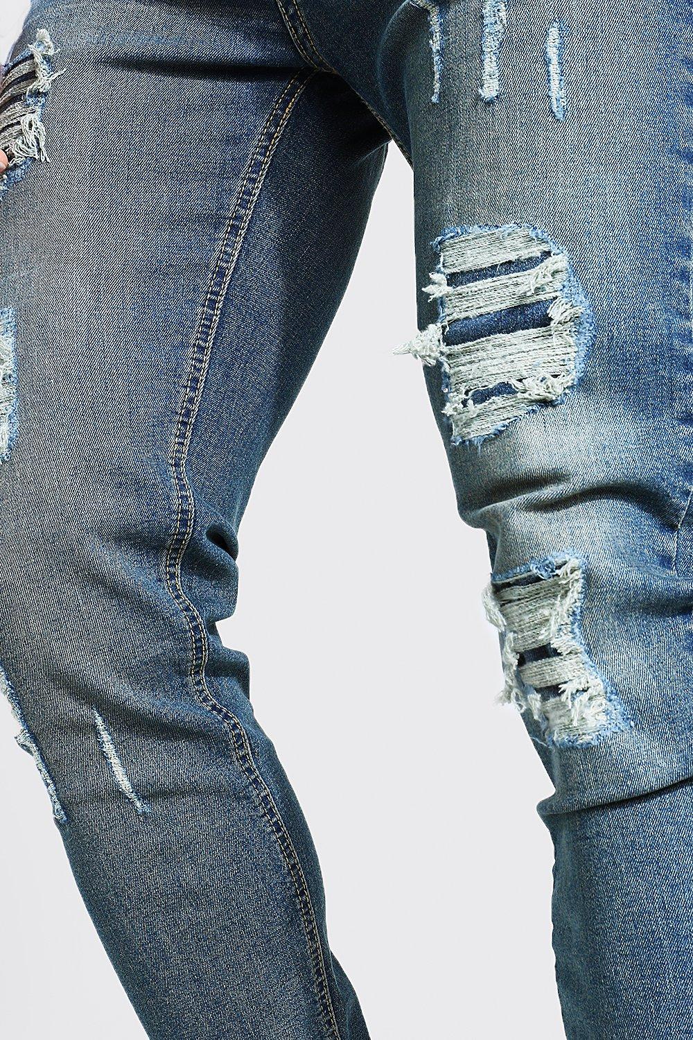 Ripped and repaired store jeans mens skinny